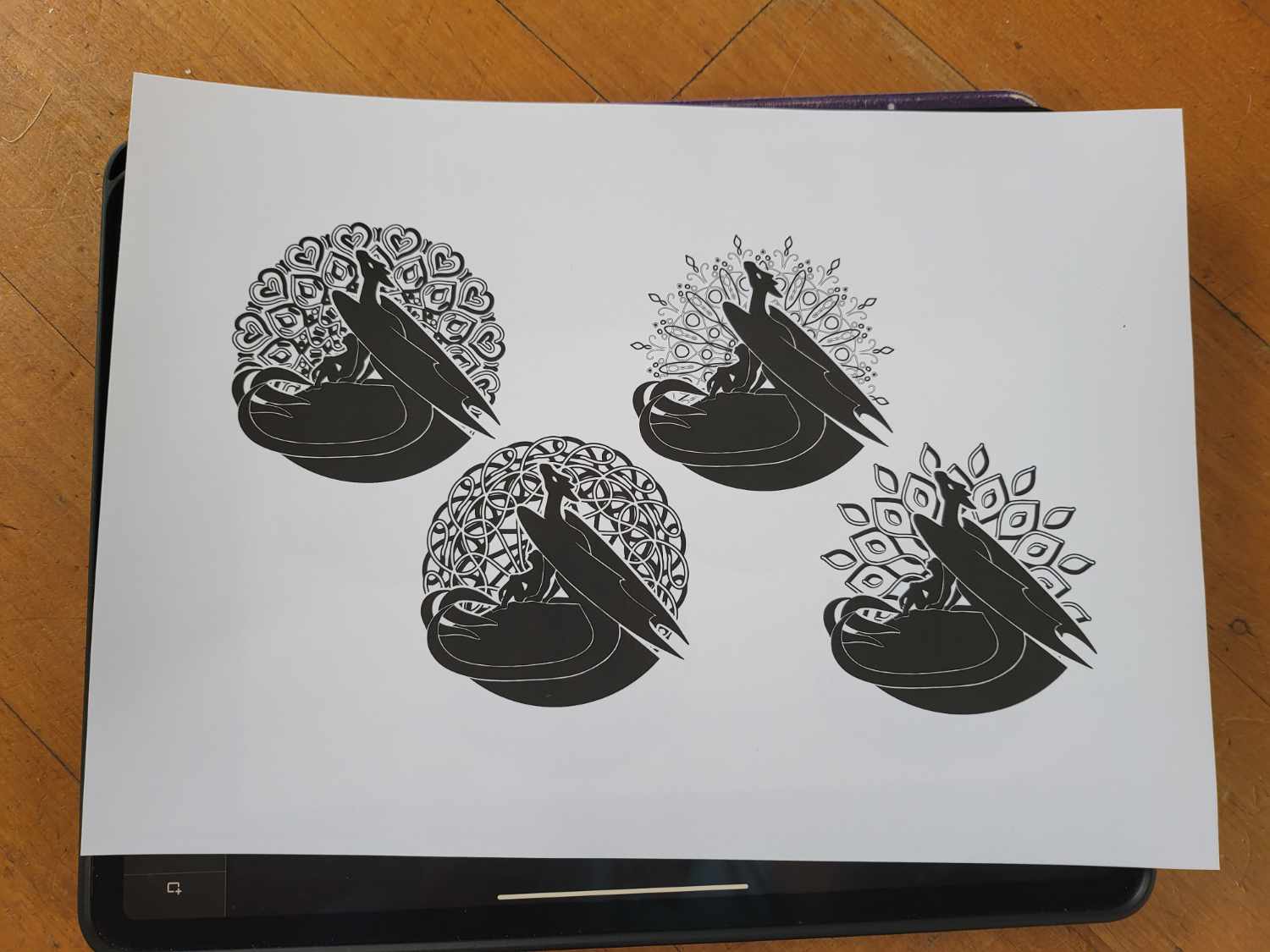 Four dragon designs printed in black on white paper.