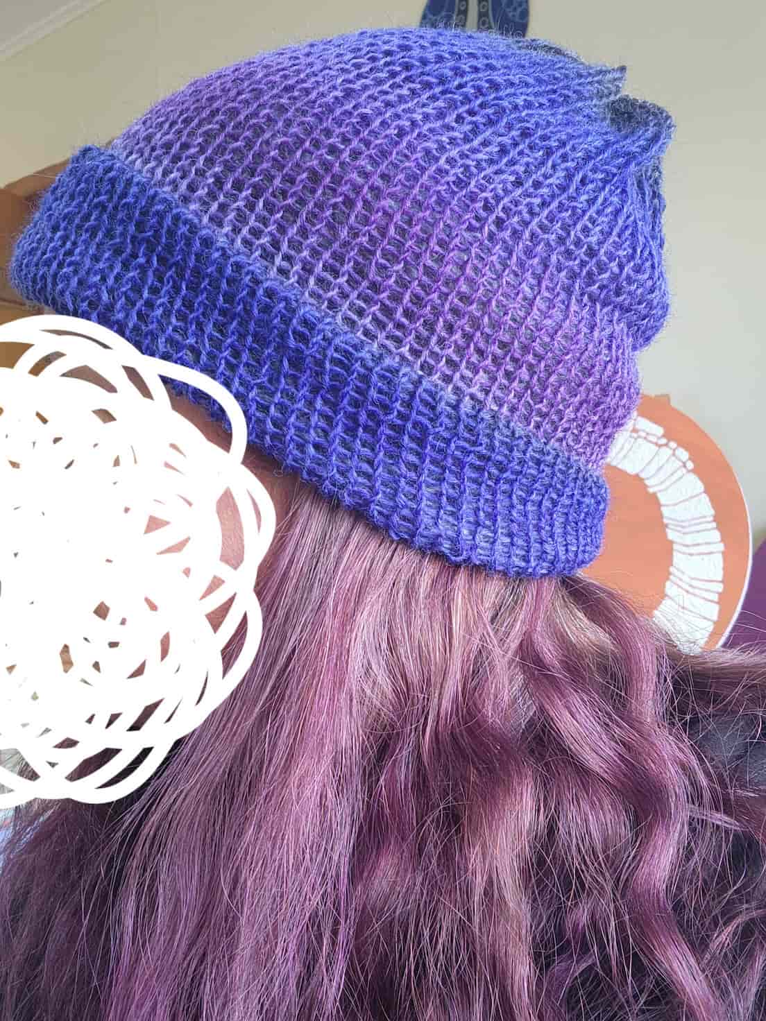 A beanie with gradient different shades of purple.